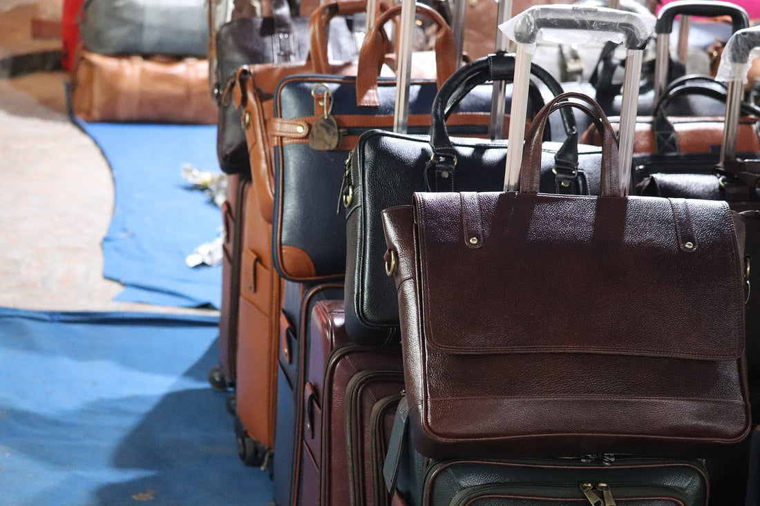 A Guide to Men's Leather Bags: Find Your right bag. A selection of different quality leather bags lined up bu Opulus Prestige